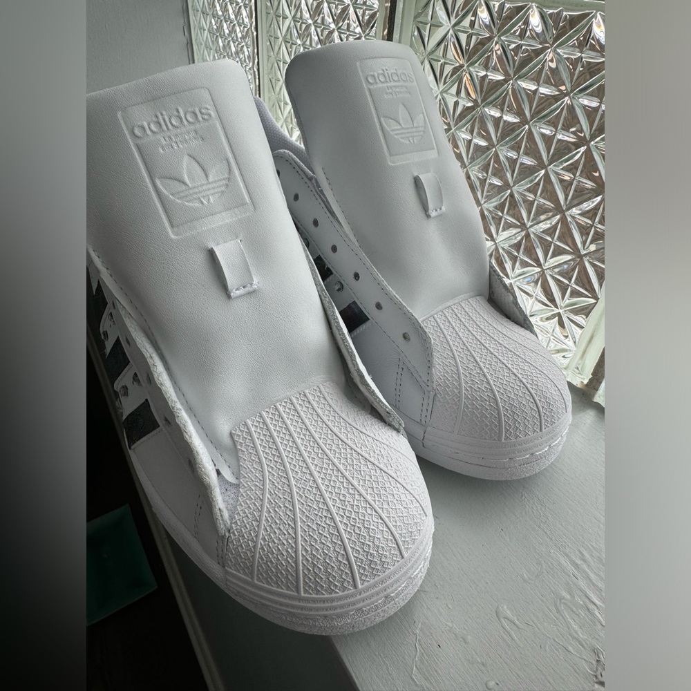 SOLD!!!Women's Adidas Superstars all white, with added flair.